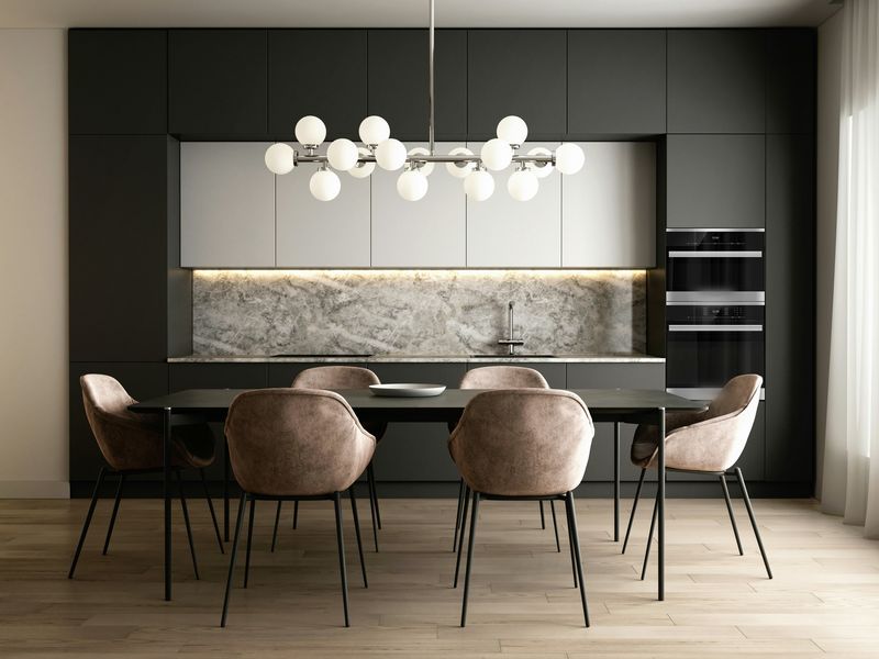 Tall dark cabinets in front of a stone wall