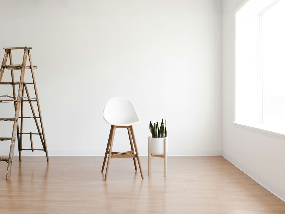 Light wood-look flooring with a ladder and a plant