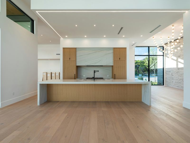 A new kitchen in light wood with a big island