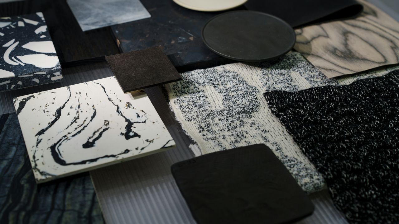 Stone and fabric samples laid out on a table