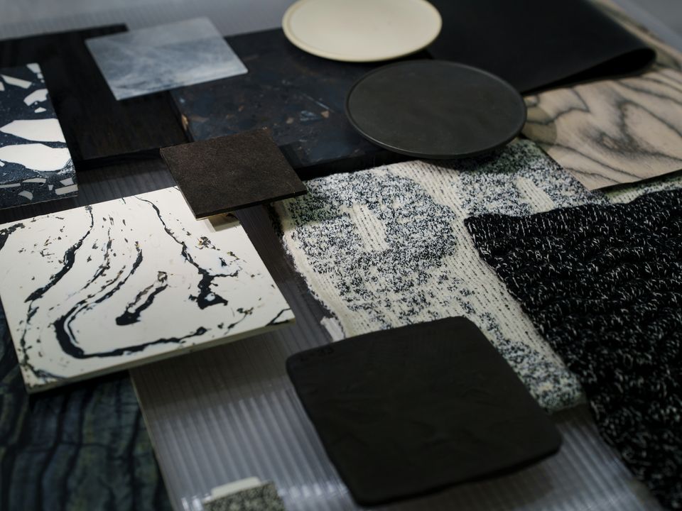Stone and fabric samples laid out on a table